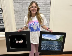 Samantha Mentnech  pictured with her photograph, Nick! and her painting, Minnewaska. 